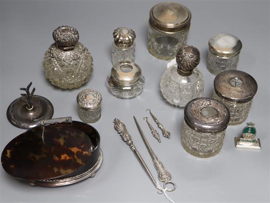 A silver-mounted tortoise-shell box (a.f.) and a quantity of silver-mounted toilet items, etc.